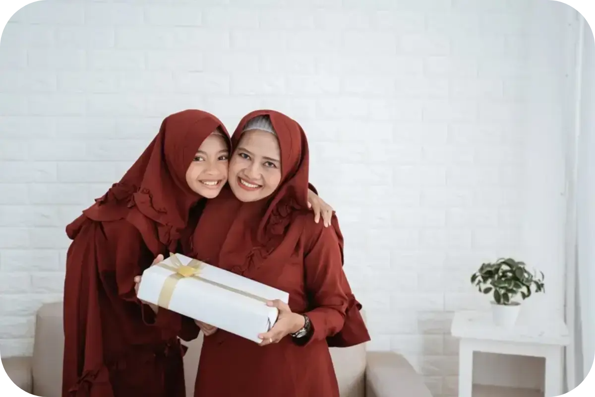 A Muslim mother giving her daughter a gift