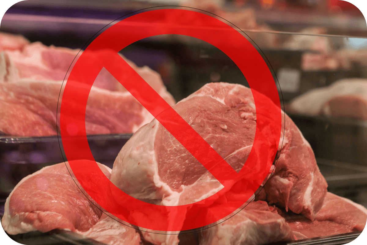 Raw pork meat with not allowed sign on it