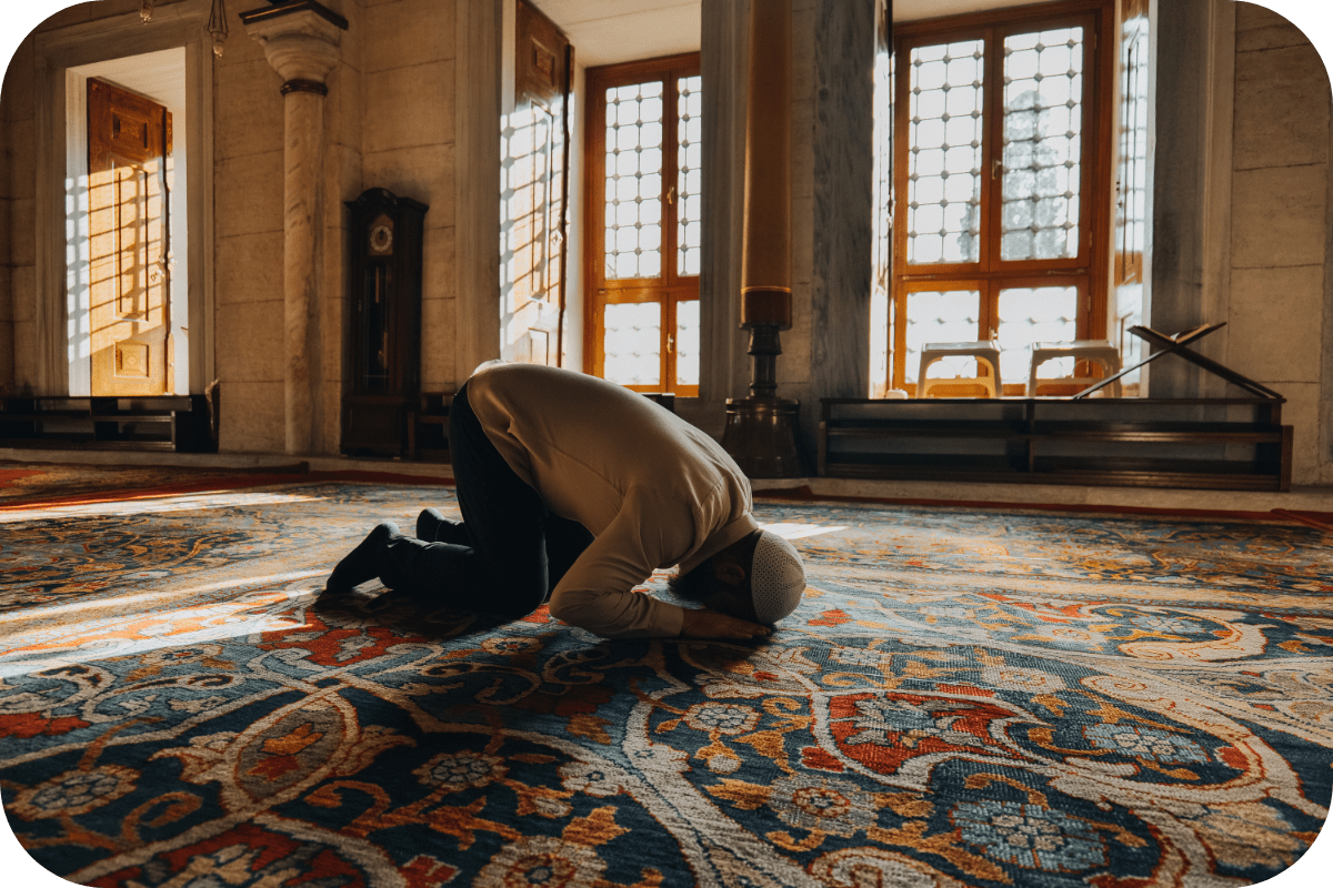 a man praying in mosque