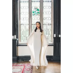 Perfect Gift * MADE TO ORDER * PLEASE ALLOW 3-4 WEEKS FOR ALL BRIDAL ORDERS.   EDITOR'S NOTE New show-stopping design. High quality flowy tuille and chiffon cape, carefully hand embellished with pearls. Paired with a matching bell sleeve plisse dress which can be worn elegantly on its own. Guaranteed to turn heads at weddings or special events. Luxury at its finest. Matching scarf is included.&nbsp; Made in the UAE.&nbsp;  SIZE/FIT Model wears: Abaya size 58 Model's height: 5ft 5inches/165 cm (w/o heels)  PRODUCT DETAILS/CARE Wash care: Hand wash 30oC, Do not tumble dry and low heat iron.    PLEASE NOTE SOME OF THE COLOURS MAY VARY SLIGHTLY IN REAL DUE TO THE LIGHTING AND BRIGHTNESS ON COMPUTER SCREENS