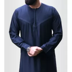 Perfect Gift Our simple yet elegant Omani/Emirati style Thobe.&nbsp; The contrast stitching on the chest and sleeves adds a touch of elegance and sophistication to the Thobe, making it stand out from other traditional attire. Material: Wool and Polyester blendFeatures:Contrast stitching on the chest and sleevesMatching zip on Placket2 side pockets