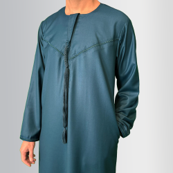 Perfect Gift This Thobe captures the spirit of simplicity, mobility, and practicality, reflecting the everyday wearability of the Thobe. This garment is both rooted in tradition and suited for modern, active lifestyles, much like the nomadic way of life that has shaped Emirati culture. Material: Wool and Polyester blendFeatures:Embroidery on the chest and sleevesHidden zip for a seamless designDetachable tasselSide pockets