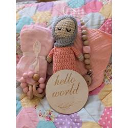 Perfect Gift Looking for the perfect baby gift? Look no further! Our handmade crochet doll set includes everything a newborn needs - a doll, swaddle, teether, bib, and a "Hello World" wooden plate. Each piece is lovingly crafted with fine attention to detail and comes in an adorable gift bag. Don't miss out on this delightful bundle! Doll - approximately 19cm tall Choose between the blue and pink sets.