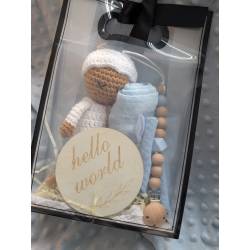 Perfect Gift Looking for the perfect baby gift? Look no further! Our handmade crochet doll set includes everything a newborn needs - a doll, swaddle, teether, bib, and a "Hello World" wooden plate. Each piece is lovingly crafted with fine attention to detail and comes in an adorable gift bag. Don't miss out on this delightful bundle! Doll - approximately 19cm tall Choose between the blue and pink sets.