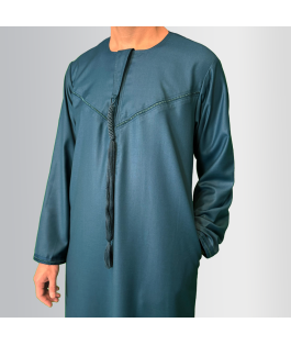 Perfect Gift This Thobe captures the spirit of simplicity, mobility, and practicality, reflecting the everyday wearability of the Thobe. This garment is both rooted in tradition and suited for modern, active lifestyles, much like the nomadic way of life that has shaped Emirati culture. Material: Wool and Polyester blendFeatures:Embroidery on the chest and sleevesHidden zip for a seamless designDetachable tasselSide pockets