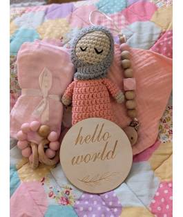 Perfect Gift Looking for the perfect baby gift? Look no further! Our handmade crochet doll set includes everything a newborn needs - a doll, swaddle, teether, bib, and a "Hello World" wooden plate. Each piece is lovingly crafted with fine attention to detail and comes in an adorable gift bag. Don't miss out on this delightful bundle! Doll - approximately 19cm tall Choose between the blue and pink sets.