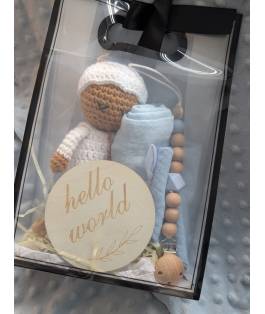 Perfect Gift Looking for the perfect baby gift? Look no further! Our handmade crochet doll set includes everything a newborn needs - a doll, swaddle, teether, bib, and a "Hello World" wooden plate. Each piece is lovingly crafted with fine attention to detail and comes in an adorable gift bag. Don't miss out on this delightful bundle! Doll - approximately 19cm tall Choose between the blue and pink sets.